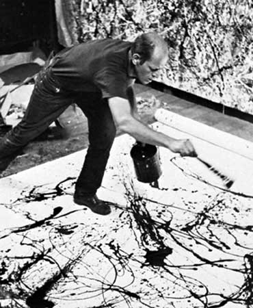 Jackson Pollock painting in his studio on Long Island, New York, 1950.